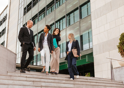 Several coworkers outside the office