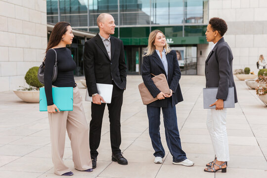 Several coworkers outside the office