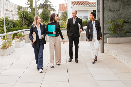 Several coworkers outside the office