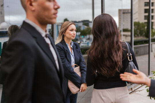Several coworkers outside the office