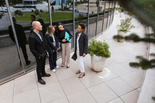 Several coworkers outside the office