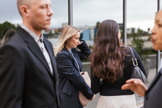 Several coworkers outside the office