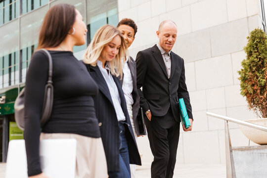 a diverse work group leaving the work day