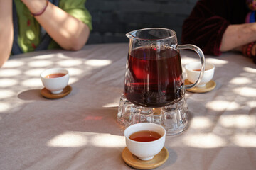 Closeup of tea cups and tea on the dining table