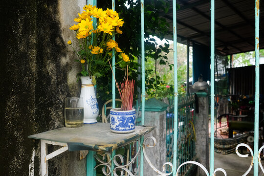 Small Home Shrine with Flowers and Incense