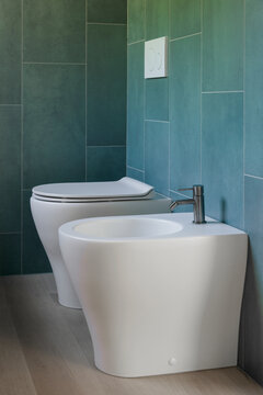 Modern Bathroom with White Toilet and Bidet