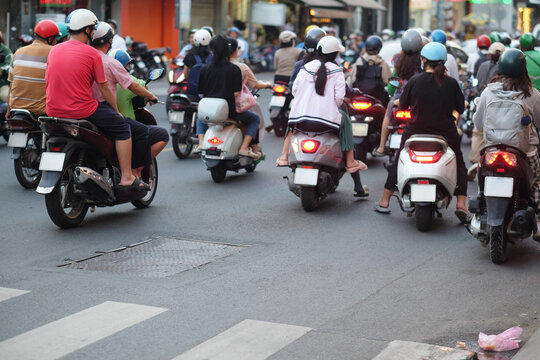 Motorbike Traffic at Rush Hour in Southeast Asia - Powered by Adobe