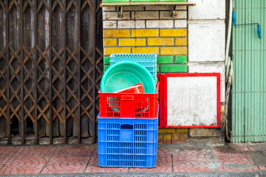 Stacked Plastic Crates on a Vibrant Urban Street