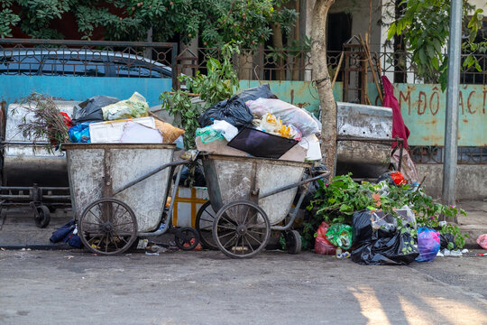 Overfilled Garbage Carts on Street