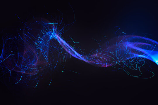 Flowing blue radio waves on black