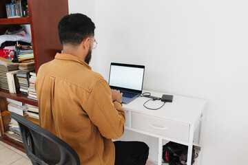 Unrecognizable person working with a hard disk in his computer.