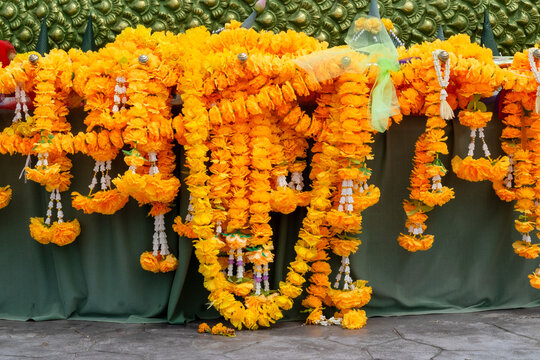 Traditional Yellow Marigold Garlands Hanging at a Temple