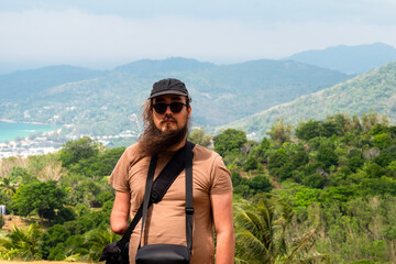 Man Standing with a Stunning View Behind Him