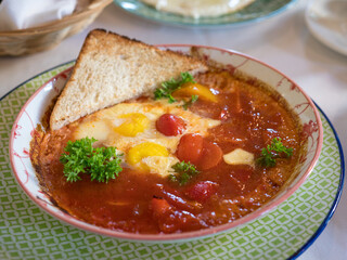Baked eggs with tomato and bell peppers.