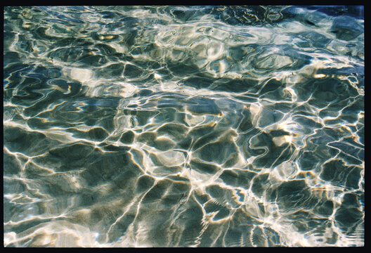 Rippling water displays a beautiful interplay of light and shadows.