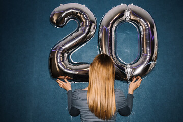 Celebration of twenty with metallic balloons at a birthday party