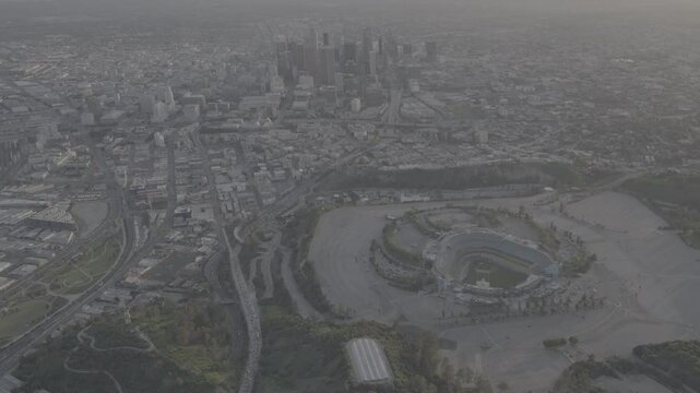 Aerial view of Dodger Stadium and Chavez Ravine at Sunset with Downtown Los Angeles in the background - SLog3