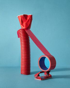 Abstract Sculpture Made of Everyday Objects on Blue Background