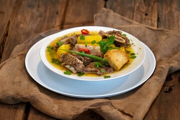 Traditional rustic Brazilian soup known as vaca atolada, prepared with cassava and beef ribs