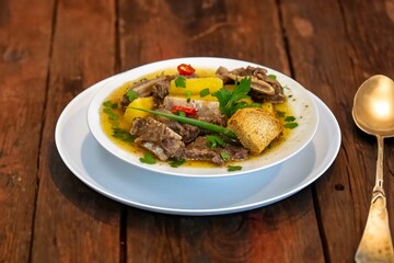 Traditional rustic Brazilian soup known as vaca atolada, prepared with cassava and beef ribs