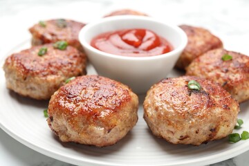 Delicious patties served on white table, closeup