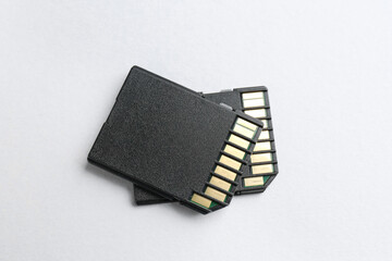 Two SD memory cards on white background, top view