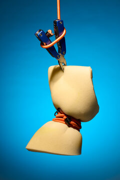 Suspended Foam Block Gripped by Multitool and Ropes