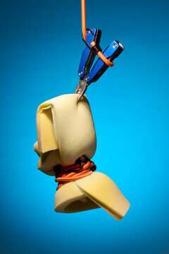 Suspended Foam Block Gripped by Multitool and Ropes
