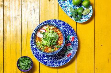 Delicious tortilla fried Aztec soup paired with fresh toppings and festive decorations for Cinco de Mayo celebrations