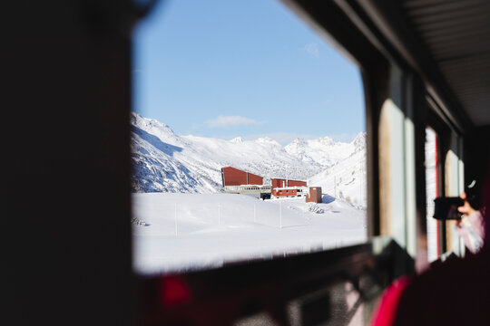 Snowy mountain landscape seen from a train window