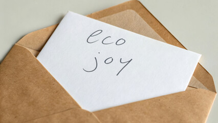 Eco friendly note inside brown envelope emphasizes customer satisfaction and joy in communication