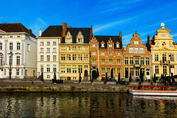 Fototapeta premium Medieval buildings in historical center of Ghent reflecting in water of river Leie Flanders, Belgium