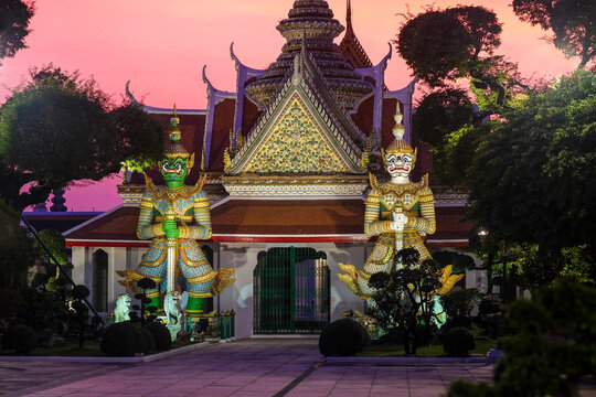 Wat Arun Guardian Statues at Sunset