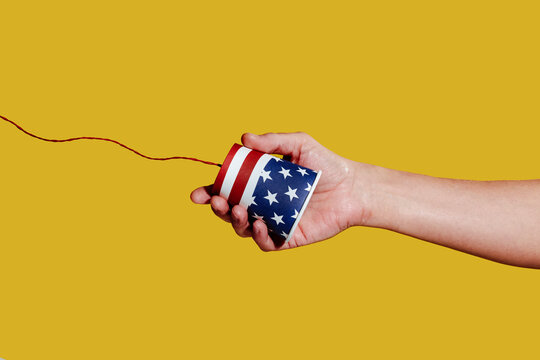 man grabs an american string telephone
