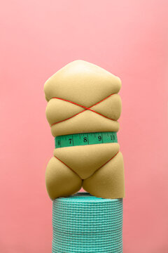 Compressed Foam with Measuring Tape on Rolled Yoga Mat