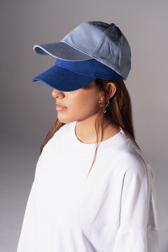 Woman in baseball cap and stylish clothes