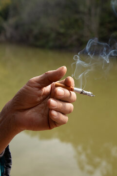 hand holding cigarette