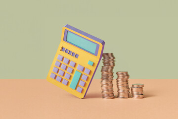 Calculator made of paper and stacks of cent coins