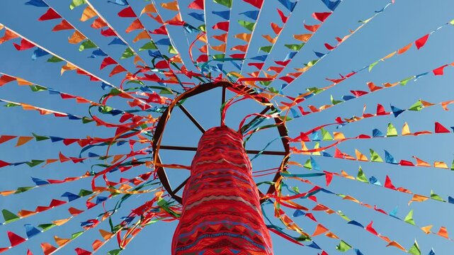 Colorful ribbons and flags decorating a maypole in Moscow for traditional celebration