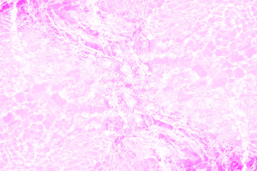 Pink water bubbles on the surface ripples. Defocus blurred transparent pink colored clear calm water surface texture with splash and bubbles. Water waves with shining pattern texture background