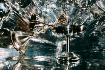 Silver chalices on a reflective surface create a stunning look