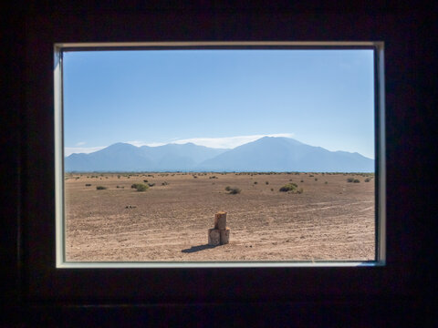 A picture frame window looking at the desert