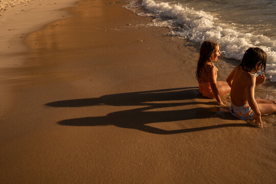 Kids shadow on the beach.
