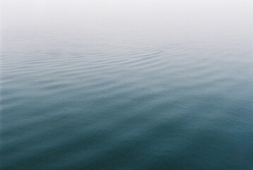 Nature texture film photo of still water with fog