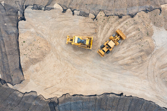 Construction Vehicles on Elevated Earth Mound