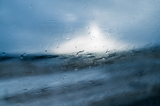 snowy Landscape Seen Through a Rainy Window