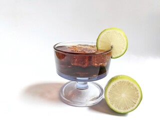 A glass of iced tea with a slice of lemon