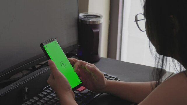 Asian Woman Scrolling Smartphone Greenscreen