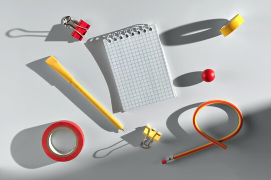 Brightly colored stationery items on a clean light desk surface.