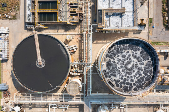 Aerial view of wastewater treatment plant with circular tanks